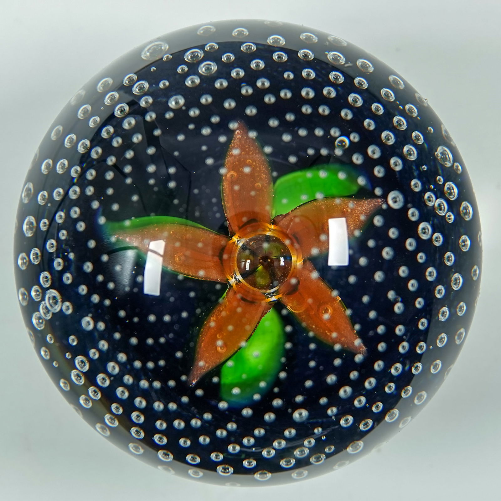 PAPERWEIGHT, Caithness Glass. Petals.: PAPERWEIGHT, Caithness Glass. Caithness Petals. Signed on bottom "Caithness Petals Scotland". 2-5/8" width, 2-1/2" height. Mint.