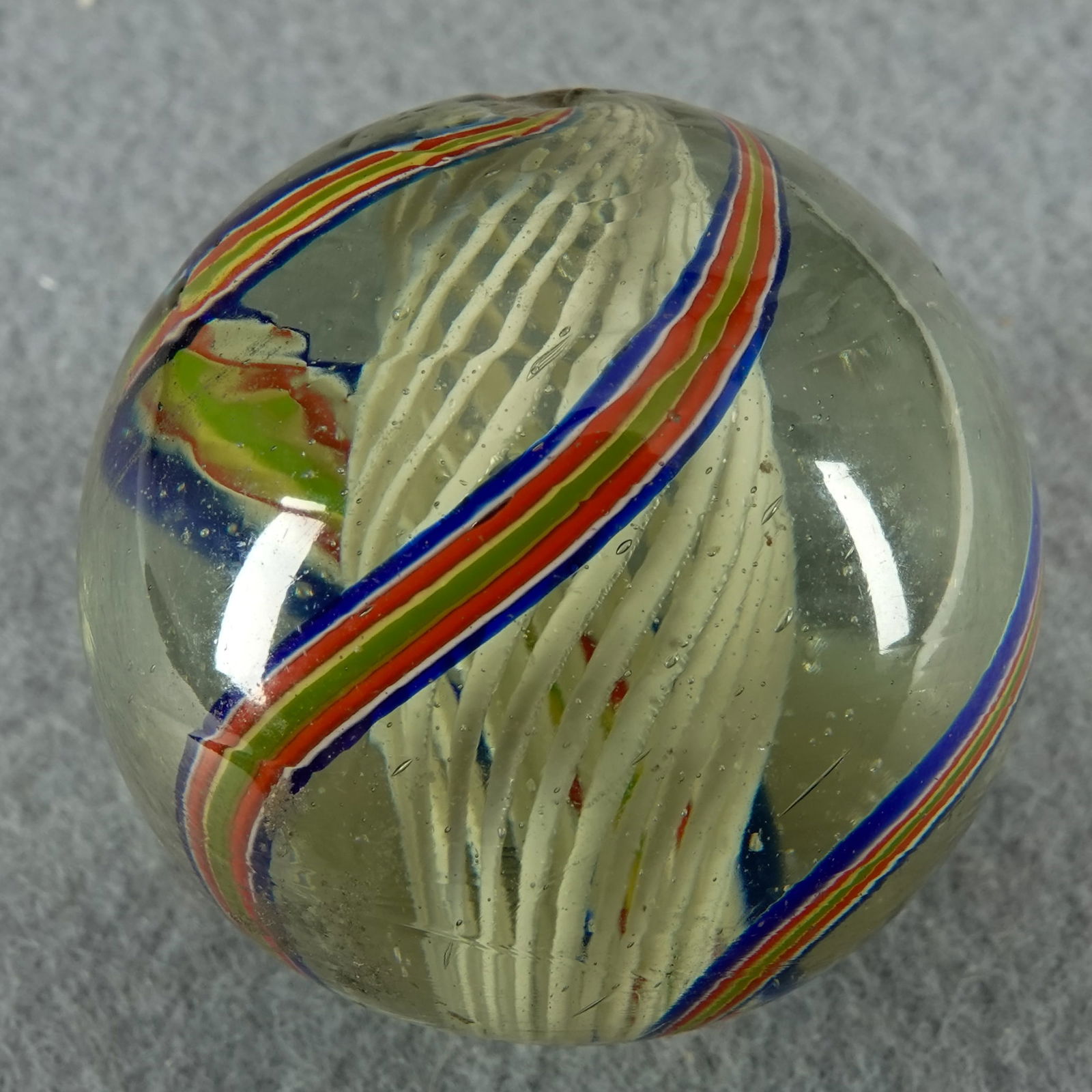 SWIRL, Latticinio Core. 1-9/16". Mint (9.9).: SWIRL, Latticinio Core. White Latticinio Core. Outer layer is three bands. Germany, circa 1860-1920. 1-9/16". Mint (9.9).