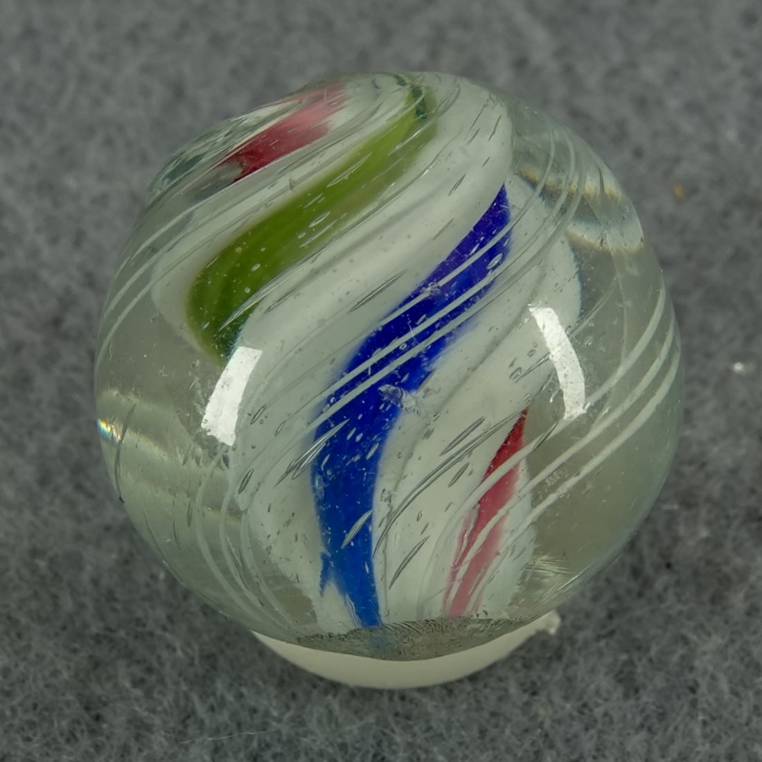 SWIRL, Solid Core. 3/4". Near Mint(+) (8.9).: SWIRL, Solid Core. Three-panel Solid Core. Each is lobed. Beautiful marble. One tiny chip. Germany, circa 1860-1920. 3/4". Near Mint(+) (8.9).