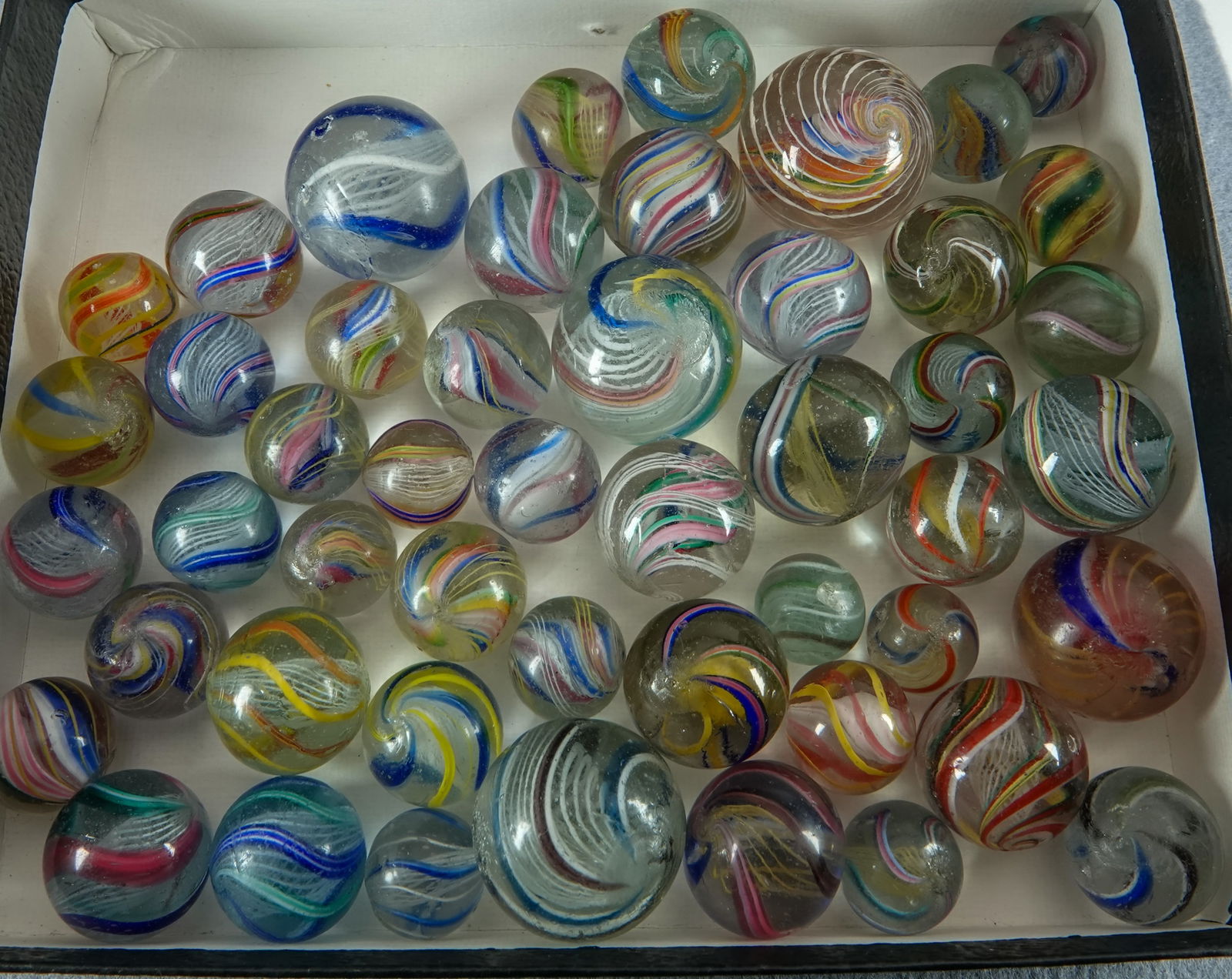 SWIRL, Assorted Core. 49 marbles. NM+ to G+. (1 of 2)