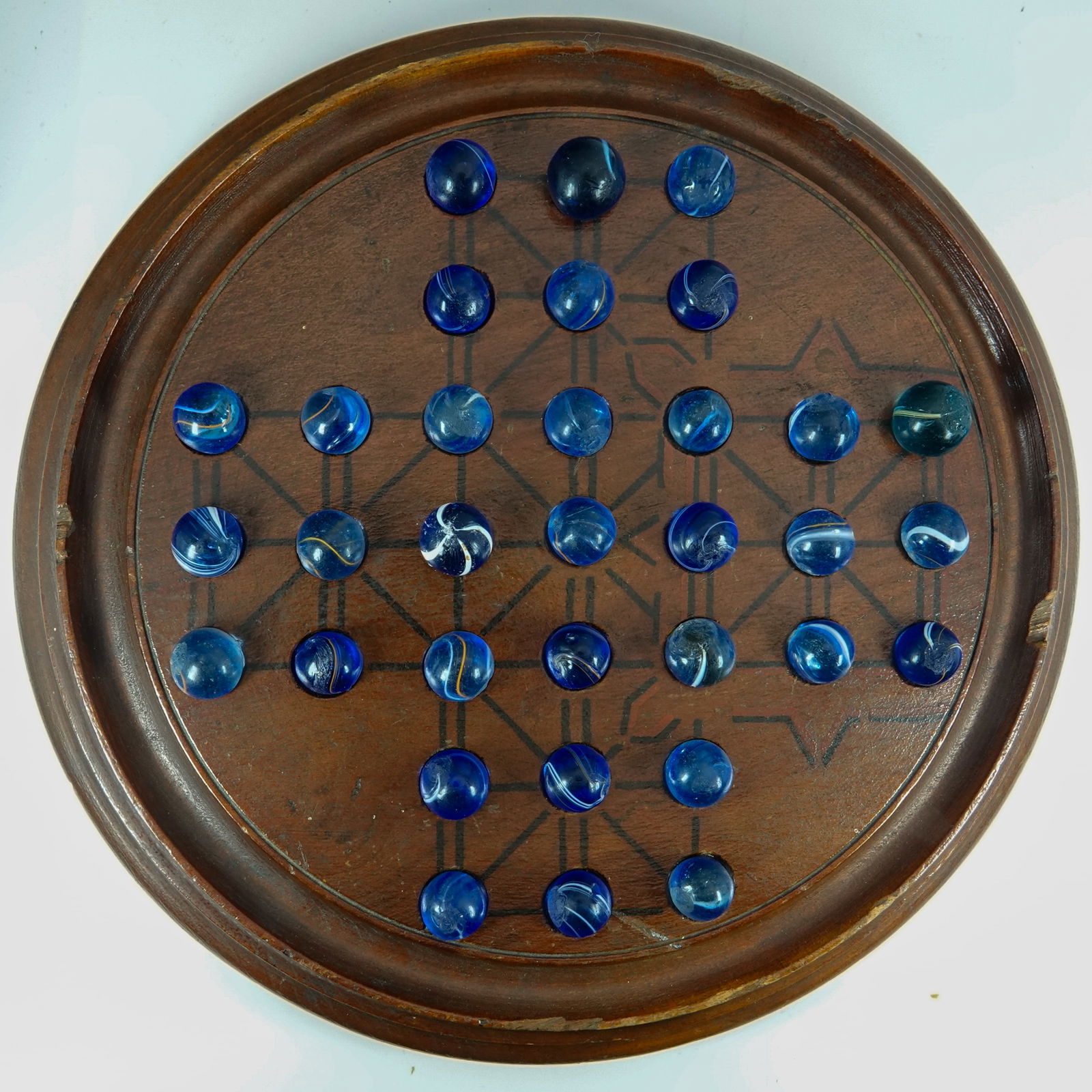 SWIRL, Banded. Antique Solitaire Board with 33 Banded Swirls and Mists.: SWIRL, Banded. Lot of thirty-three marbles on an antique Solitaire Board. Marbles are all blue base. There is a variety of Banded Swirls and Mists. Marbles are 1/2" to 19/32" and almost all are Mint.