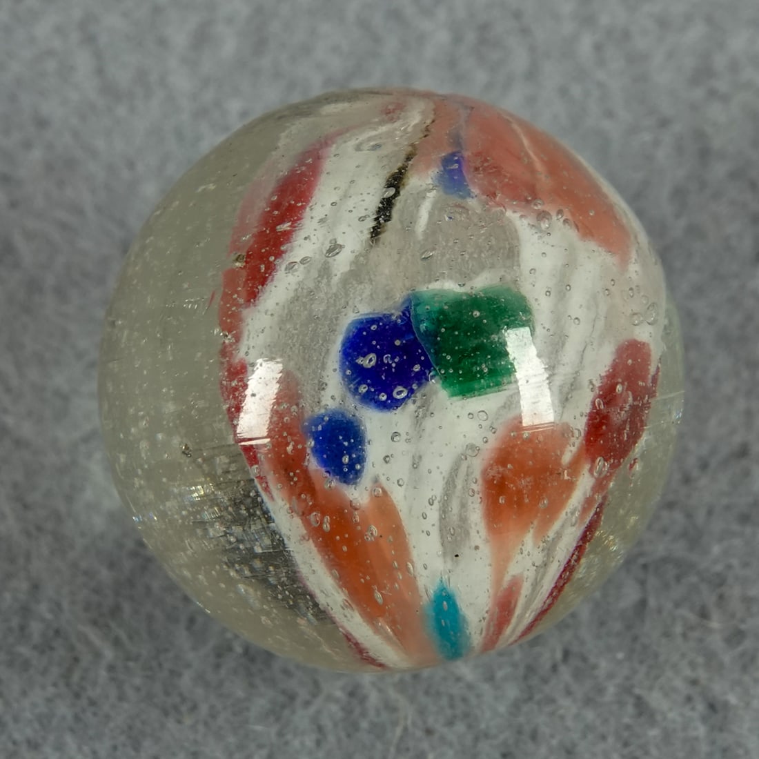 END OF DAY, Cloud. 13/16". Mint(-) (9.2).: END OF DAY, Cloud. White core with spots of pink, blue and green. Shrunken on one side. Very nice. One tiny manufacturing melt pit. Germany, circa 1860-1920. 13/16". Mint(-) (9.2).