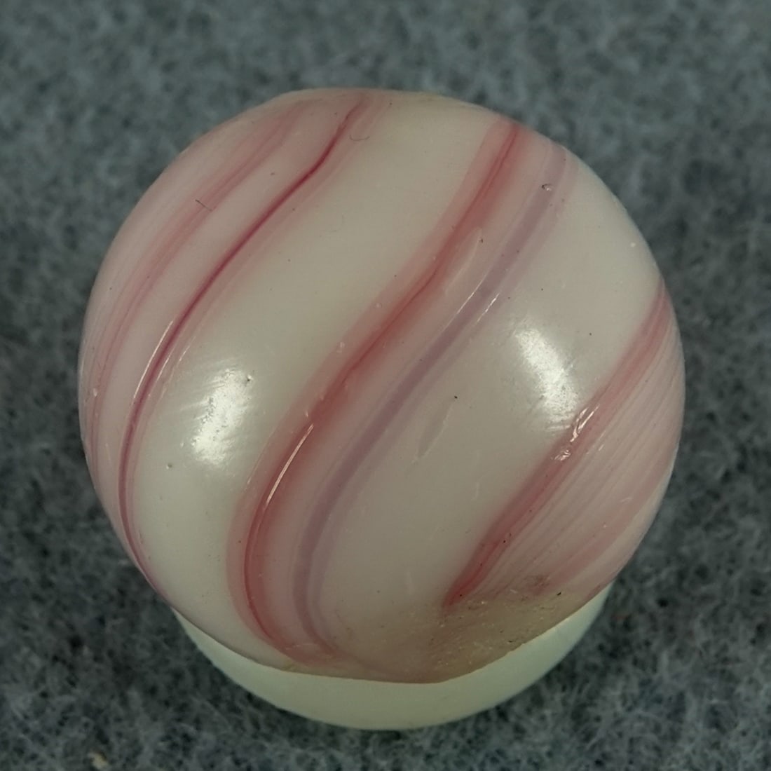 OTHER HANDMADE, Banded Opaque. 19/32". Mint (9.8).: OTHER HANDMADE, Banded Opaque. Opaque white base. Pink stretched on the marble. Germany, circa 1860-1920. 19/32". Mint (9.8).