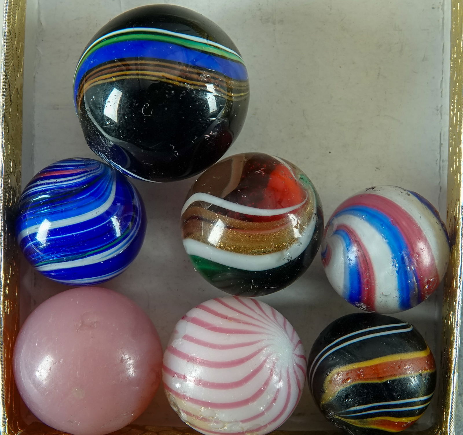 OTHER HANDMADE, Assorted. 7 marbles. Beach Ball Peppermint, Onion, Lutz, Indian, Clambroth, Melon: OTHER HANDMADE, Assorted. Lot of seven marbles. Wide variety. Includes Beach Ball Peppermint Swirl (Good), Onionskin (Near Mint+), Ribbon Lutz (Polished), two Indians (Near Mint+ and Good+), Clambroth