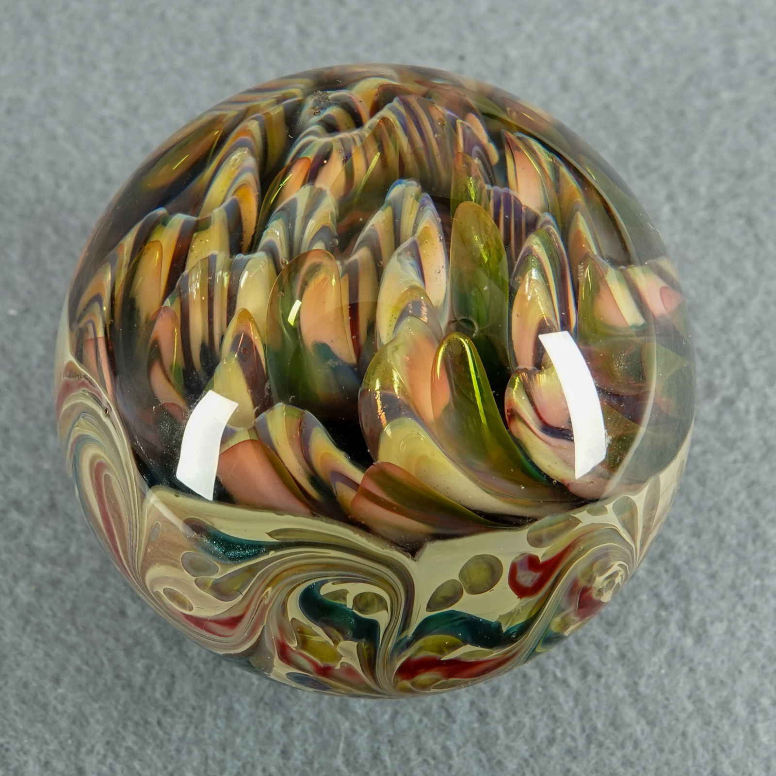 CONTEMPORARY HANDMADE, Mad Man Marbles. 1-7/8". Mint (9.9).: CONTEMPORARY HANDMADE, Mad Man Marbles. Top half is implosion and ridges. Bottom is a whorl pattern. Signed "MMM" (Joe Schlemmer). 1-7/8". Mint (9.9).