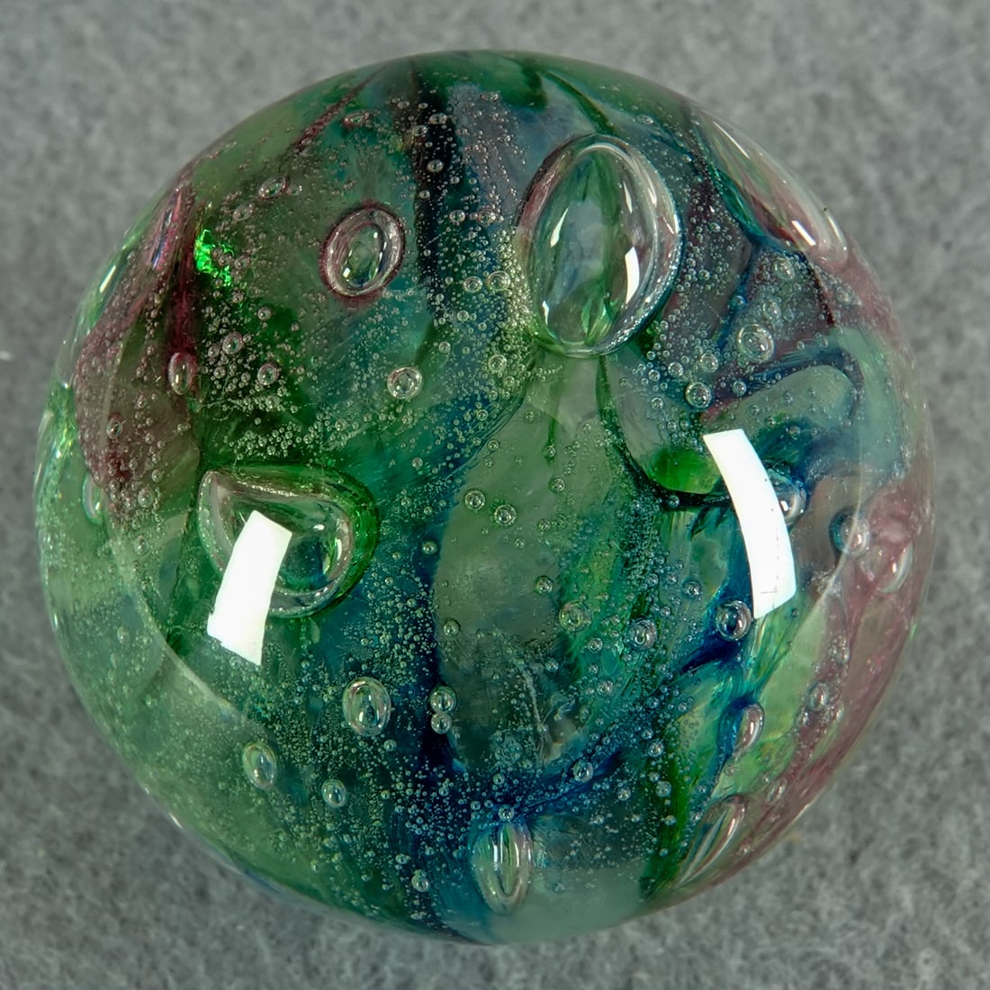 CONTEMPORARY HANDMADE, Teign Valley Glass. London Marble Show. 1-9/16". Mint (9.9).: CONTEMPORARY HANDMADE, Teign Valley Glass. Onionskin with green aventurine. TVG calls this an "Ocean Marble". It is inspired by the ocean on the coast of Devon, where TVG is located. It is one of a li