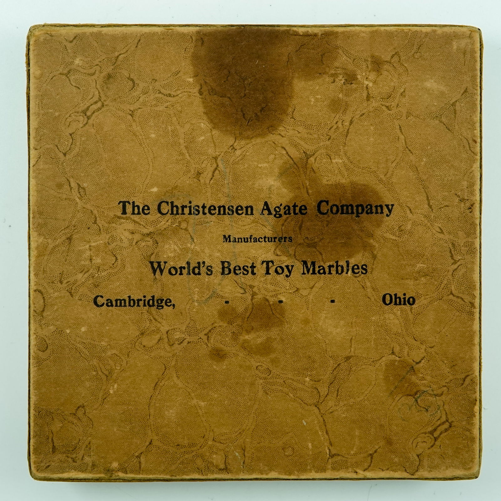 CHRISTENSEN AGATE COMPANY, Original Package. Original CAC box but contains late 20th Century: CHRISTENSEN AGATE COMPANY, Original Package. An original Christensen Agate box but does not contain Christensen Agate marbles. The box is a cardboard box, metal corner clips on lid and bottom. The box