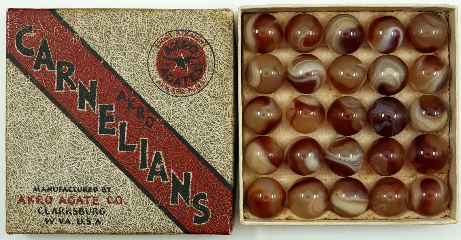 AKRO AGATE COMPANY, Original Package. Carnelians Box.: AKRO AGATE COMPANY, Original Package. An original box of "25 No. 1 Carnelians". Box has the original marbles. Box and marbles are Mint. Great set. 3-3/4" x 3-3/4". Mint.