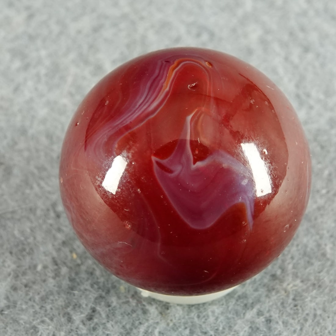 AKRO AGATE COMPANY, Cornelian. 25/32". Mint (9.9).: AKRO AGATE COMPANY, Cornelian. Opaque red and white swirl. Clarksburg WV, circa 1925-1935. 25/32". Mint (9.9).