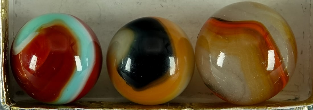 AKRO AGATE COMPANY, Corkscrew. 3 marbles. Mint.: AKRO AGATE COMPANY, Corkscrew. Lot of three marbles. Variety of colors. All are three-color. See images. Clarksburg WV, circa 1925-1935. 5/8" to 23/32". Mint.