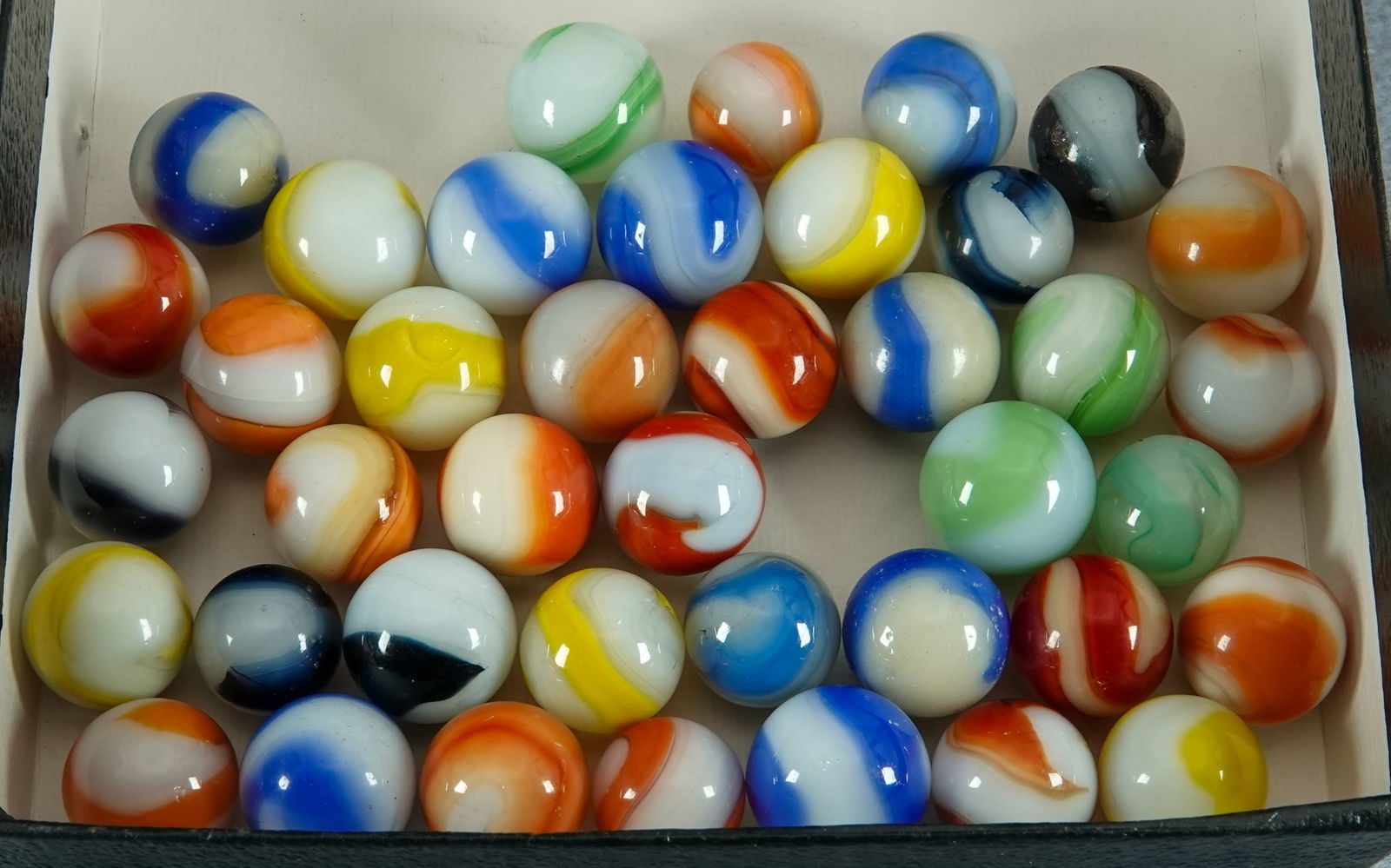 AKRO AGATE COMPANY, Corkscrew. 41 marbles.: AKRO AGATE COMPANY, Corkscrew. Lot of forty marbles. Variety of colors. See images. Clarksburg WV, circa 1925-1935. 19/32" to 11/16". Almost all are Mint.