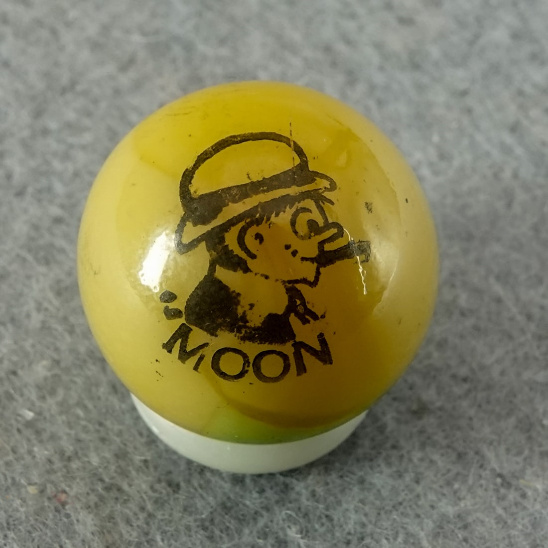 PELTIER GLASS COMPANY, Character Marble (comic). Moon. 21/32". Mint (9.9).: PELTIER GLASS COMPANY, Character Marble (comic). Moon (Mullins). Light green patch, mustard yellow base Peerless Patch. Dark transfer. Well centered. Ottawa IL, circa 1930-1935. 21/32". Mint (9.9).