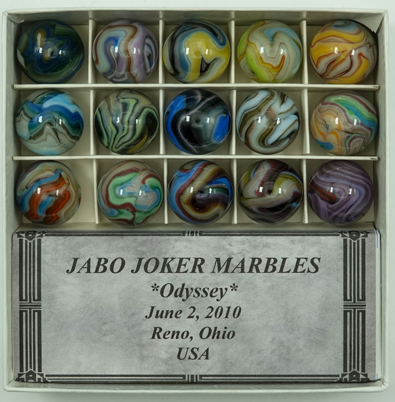 JABO/SAMMY/DAS, Jobber Box. Jabo Joker Odyssey.: JABO/SAMMY/DAS, Jobber Box. Cardboard display box containing fifteen marbles. Jabo Joker Odyssey run date June 2, 2010. 23/32". Mint.