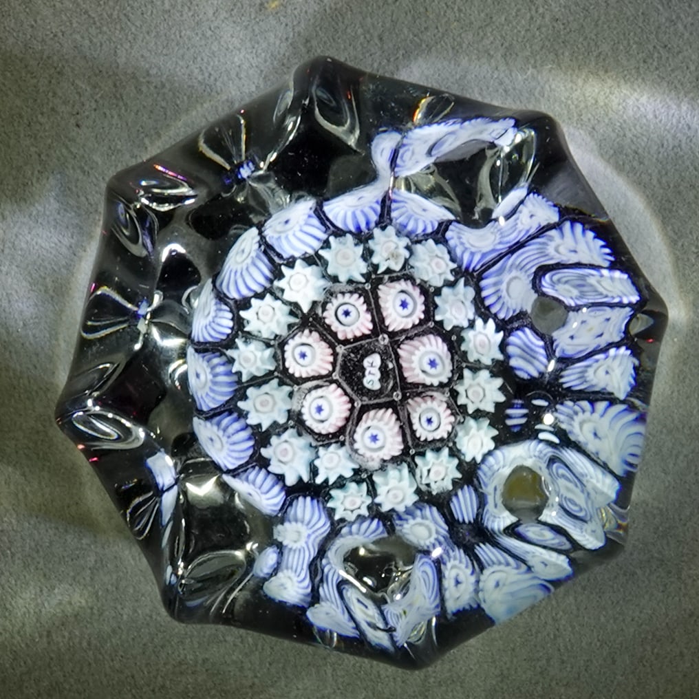 PAPERWEIGHT, Peter McDougal.: PAPERWEIGHT, Peter McDougal. Concentric rings. Crimped paperweight. Has a "PMcD" cane in the center. Scotland, circa 2010-2020. 2" wide, 1-1/4" tall .