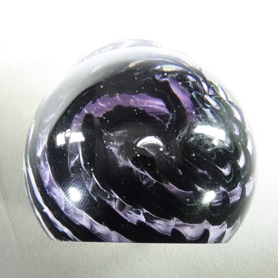 PAPERWEIGHT, Davis Glass Studio.: PAPERWEIGHT, Davis Glass Studio. Snakeskin pattern in clear. Signed on bottom "Davis Glass WV". 2-1/8" wide, 1-3/4" tall .
