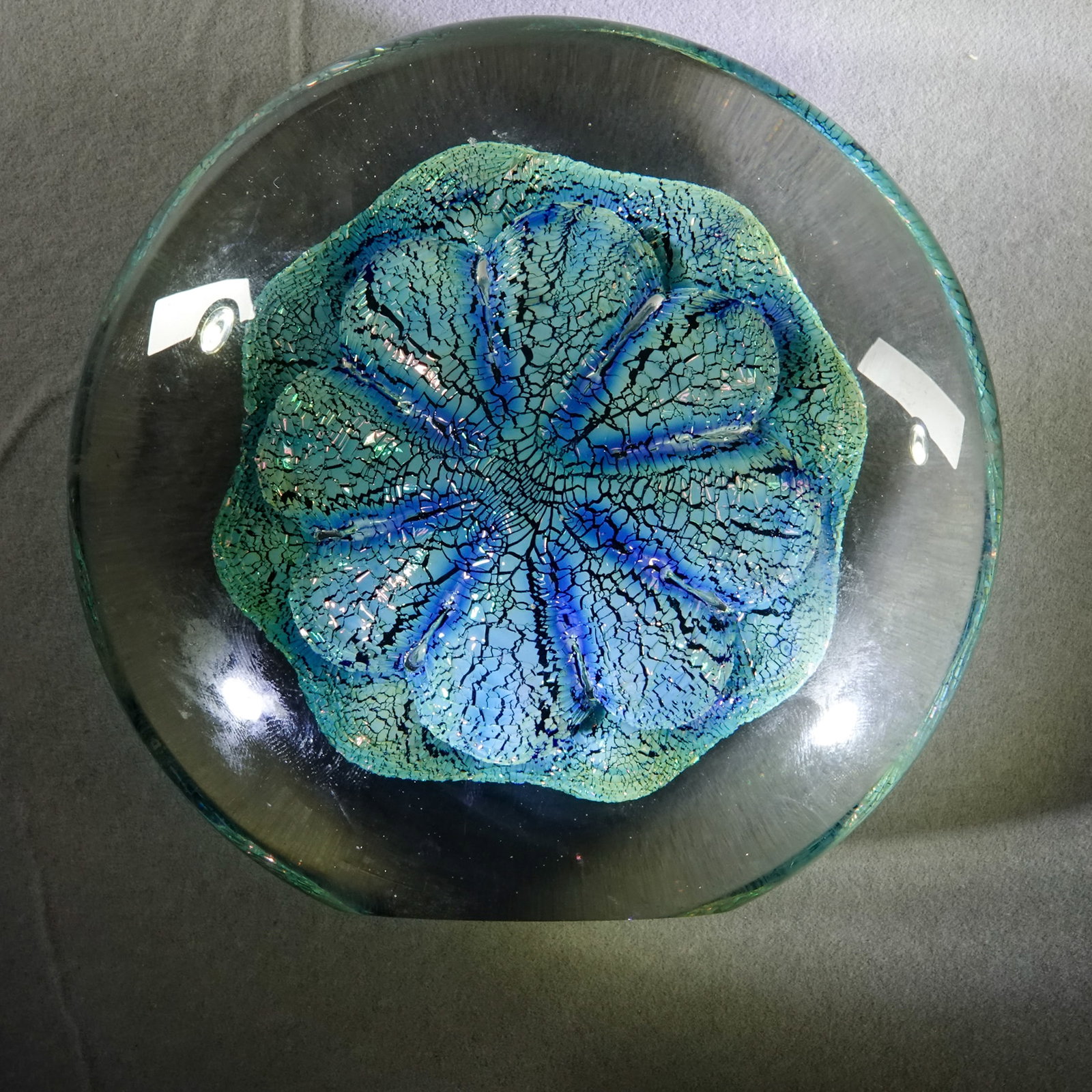 PAPERWEIGHT, Robert Eickholt.: PAPERWEIGHT, Robert Eickholt. Disk shape with flattened bottom and a flattened edge for standing. Signed "Eickholt 1994-11 DGD". 4-1/2" wide, 2" tall .