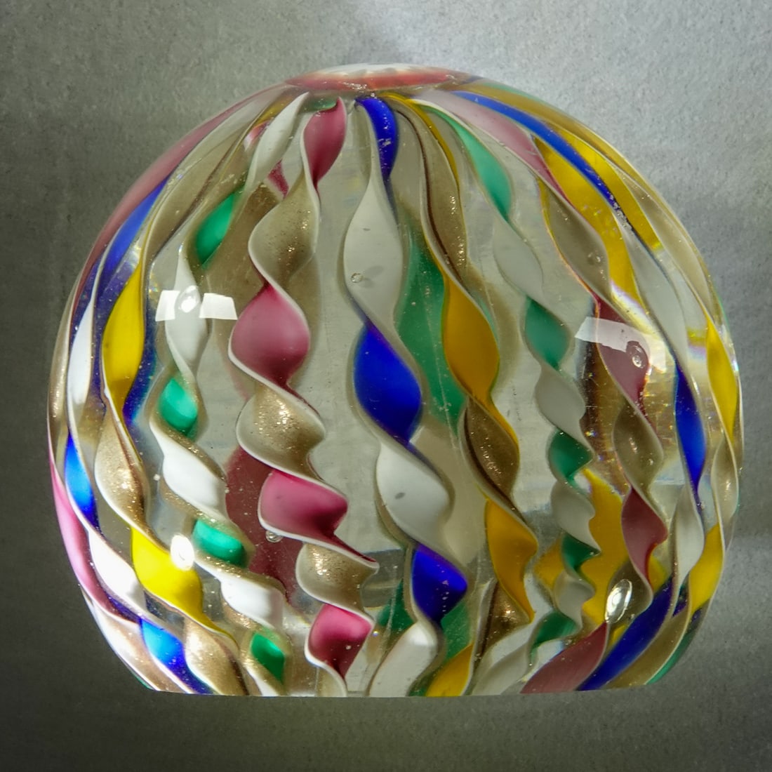 PAPERWEIGHT, Murano.: PAPERWEIGHT, Murano. Crown filigrana with lutz in the ribbons. Unsigned. We are not sure which glass house it is from in Murano. Italian, circa 1970-1990. 3" wide, 2-5/8" tall .