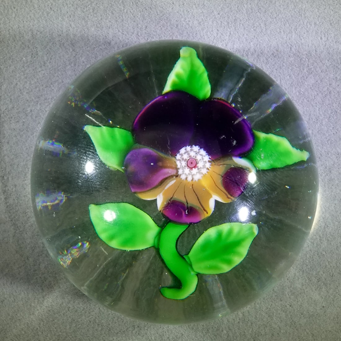 PAPERWEIGHT, Baccarat. Antique.: PAPERWEIGHT, Baccarat. Antique miniature Pansy paperweight. Star cut base. France, 1840-1860. 1-7/8" wide, 1-3/8" tall .
