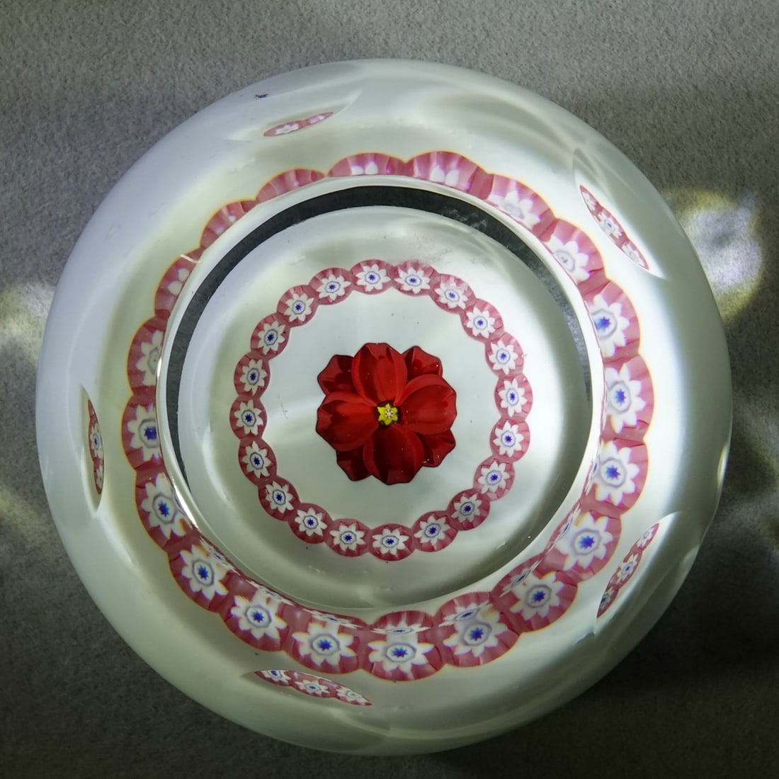 PAPERWEIGHT, Caithness.: PAPERWEIGHT, Caithness. Nice rose on white background. Faceted sides and top viewing window. Etched on bottom "Mini Rose Caithness Scotland F917". 2-1/8" wide, 1-3/4" tall .