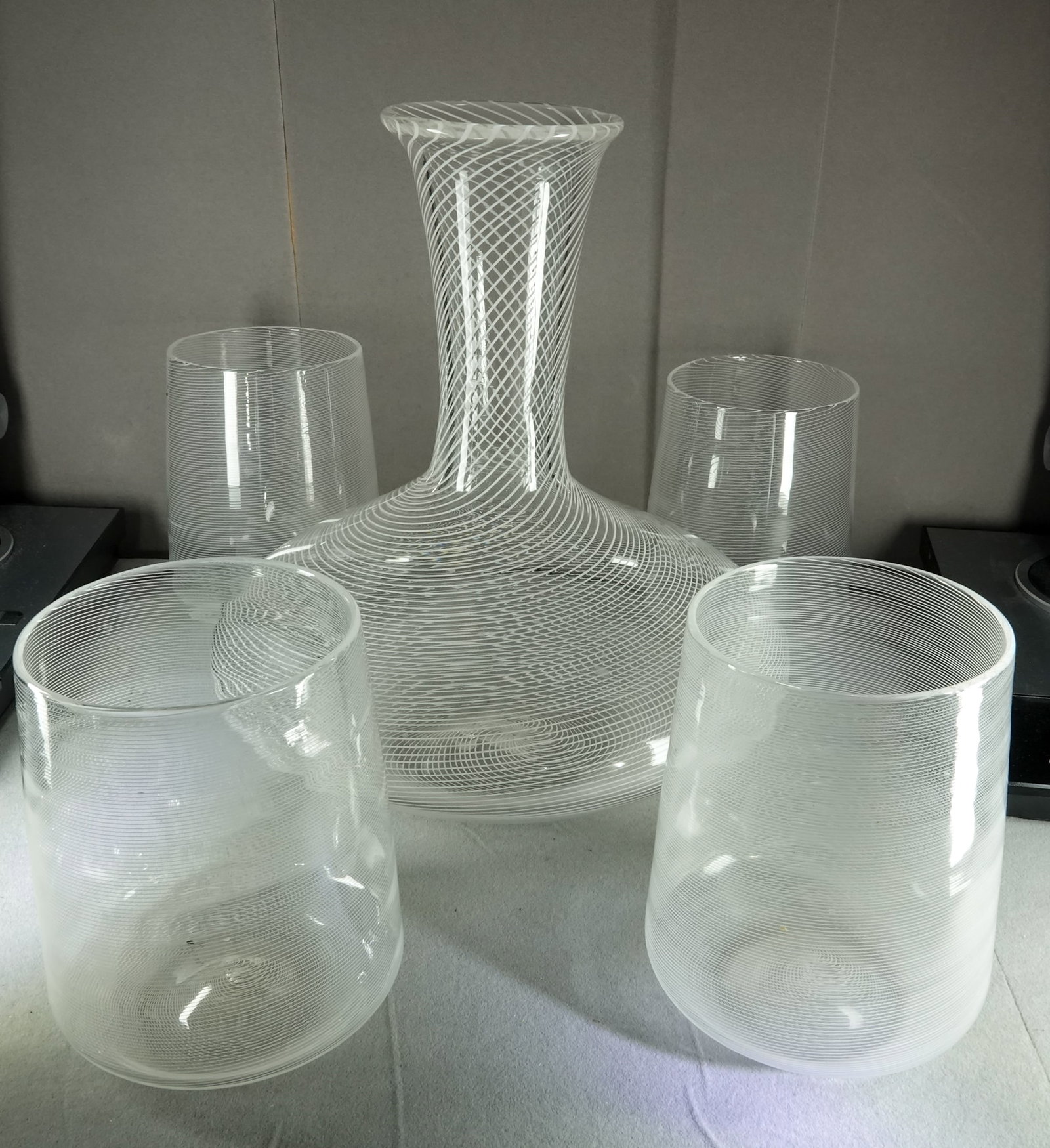 ART GLASS, Italian. Wine Decanter and 4 Glasses. Filigrana.: ART GLASS, Italian. A filigrana wine decanter with four filigrana glasses. All are signed "Parnulli". Glasses are 3-3/4" tall. Decanter is 8" tall. Beautiful set. All handblown thin glass .