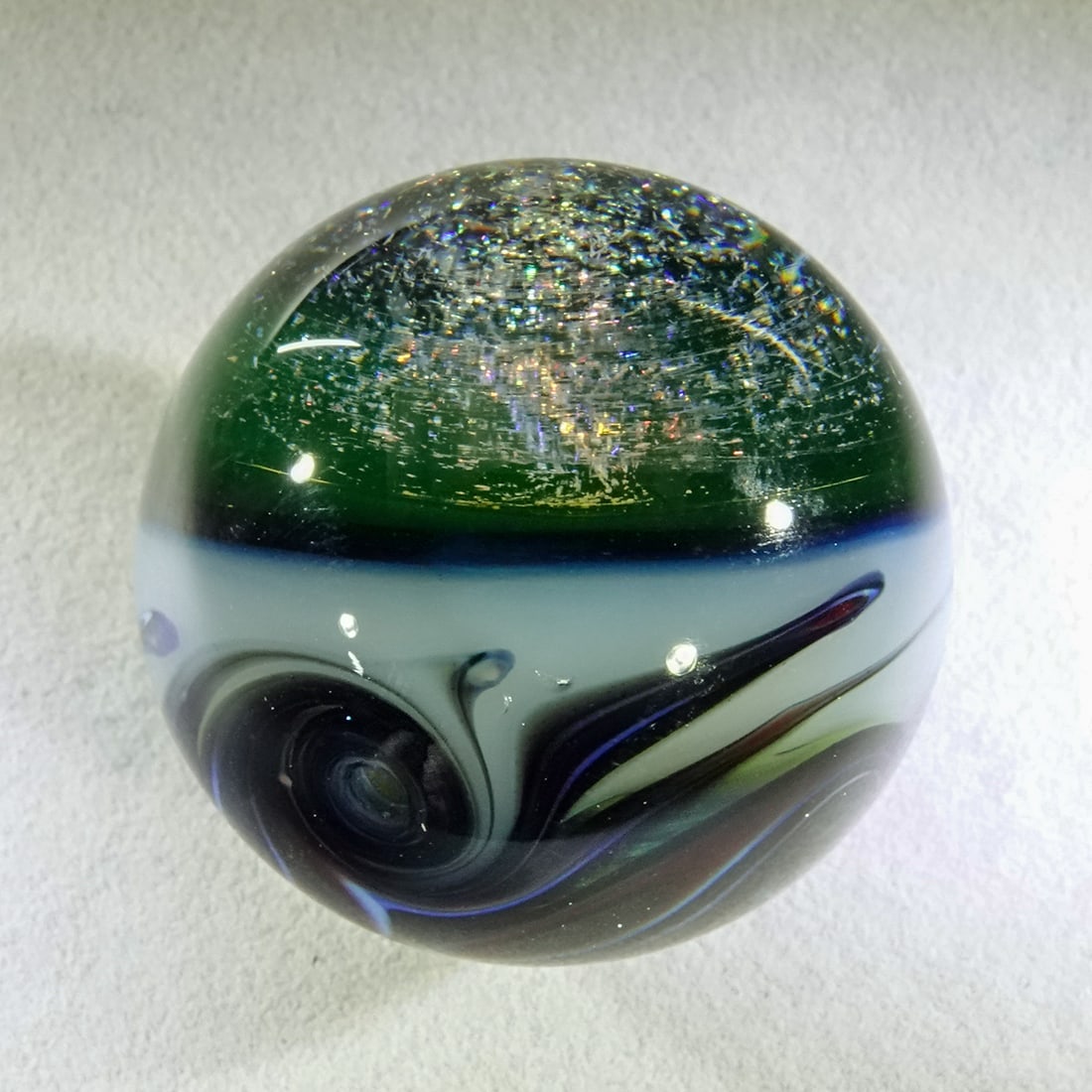 CONTEMPORARY HANDMADE, Unsigned. 1-3/8". Mint (9.9).: CONTEMPORARY HANDMADE, Unsigned. Large viewing lens at top, filled with dichroic. Bottom half is whorls. Unsigned, artist unidentified. 1-3/8". Mint (9.9).