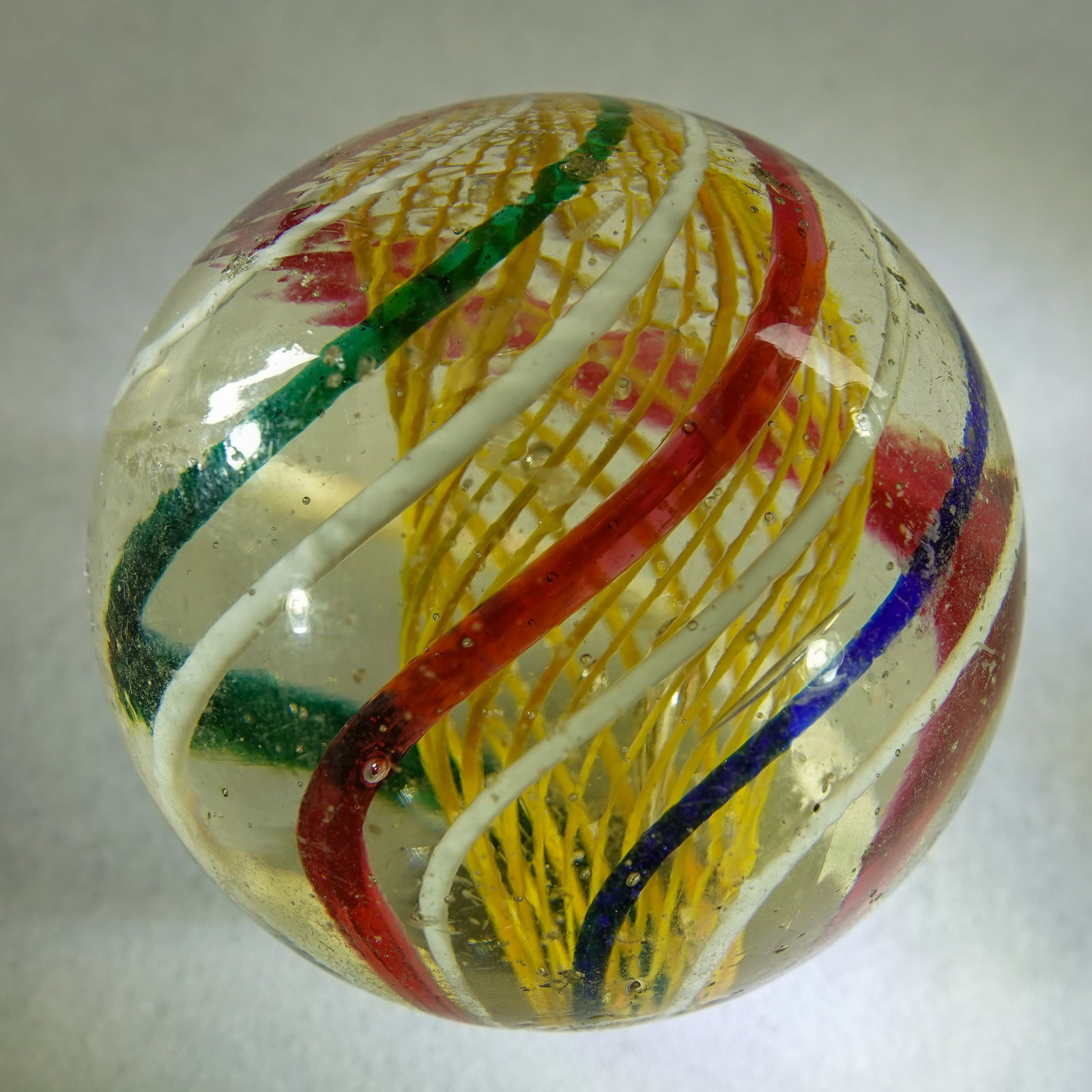 SWIRL, Latticinio Core. 1-15/16". Near Mint (8.3).: SWIRL, Latticinio Core. Yellow Latticinio Core Swirl. A couple very small chips, several tiny chips. Germany, circa 1860-1920. 1-15/16". Near Mint (8.3).