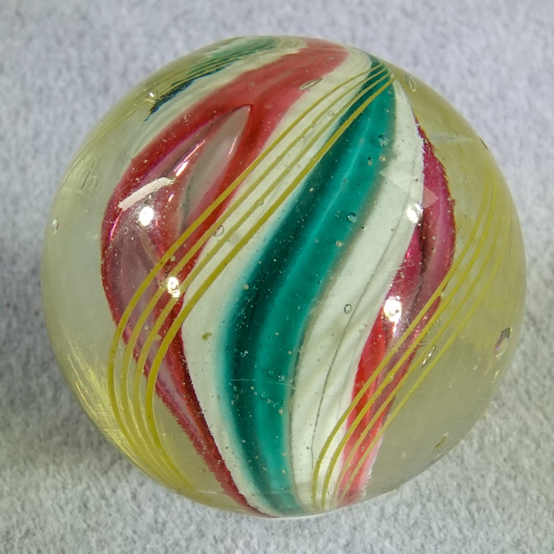SWIRL, Solid Core. 25/32". Mint(-) (9.2). - 4