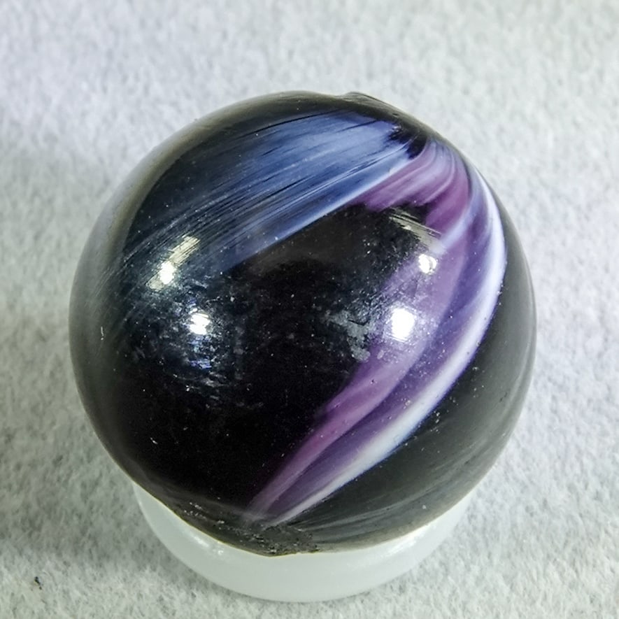 OTHER HANDMADE, Slag. 19/32". Mint (9.9).: OTHER HANDMADE, Slag. Two-pontil marble from a cane of mixed dark purple and white. Germany, circa 1860-1920. 19/32". Mint (9.9).