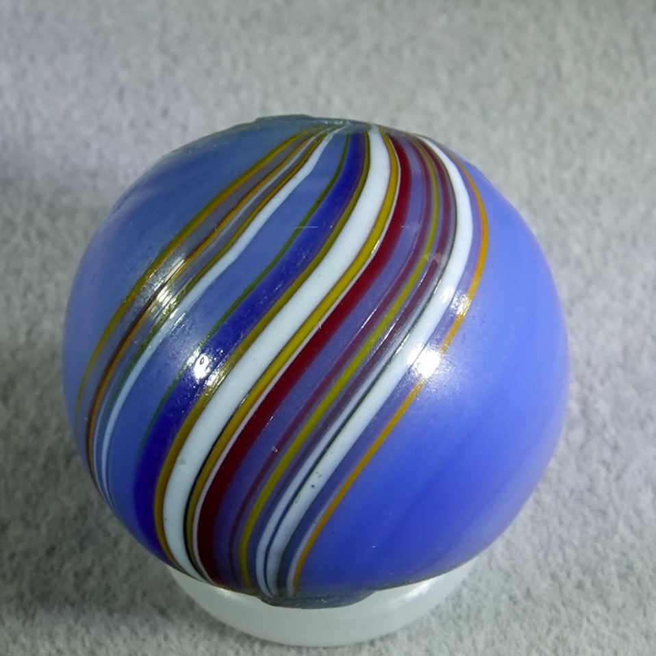OTHER HANDMADE, Banded Opaque. 11/16". Mint(-) (9.2).: OTHER HANDMADE, Banded Opaque. Opaque blue base with two bands of stretched color covering about thirty percent of the surface. One manufacturing melt spot. Germany, circa 1860-1920. 11/16". Mint(-) (