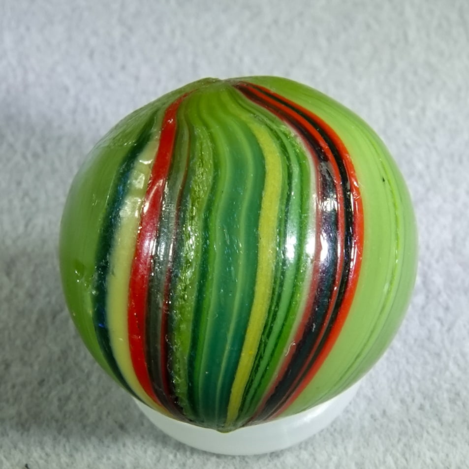 OTHER HANDMADE, Banded Opaque. 11/16". Mint(-) (9.0).: OTHER HANDMADE, Banded Opaque. Opaque green base with two bands of stretched color covering about half the marble. Two tiny manufacturing melt flakes. Germany, circa 1860-1920. 11/16". Mint(-) (9.0).