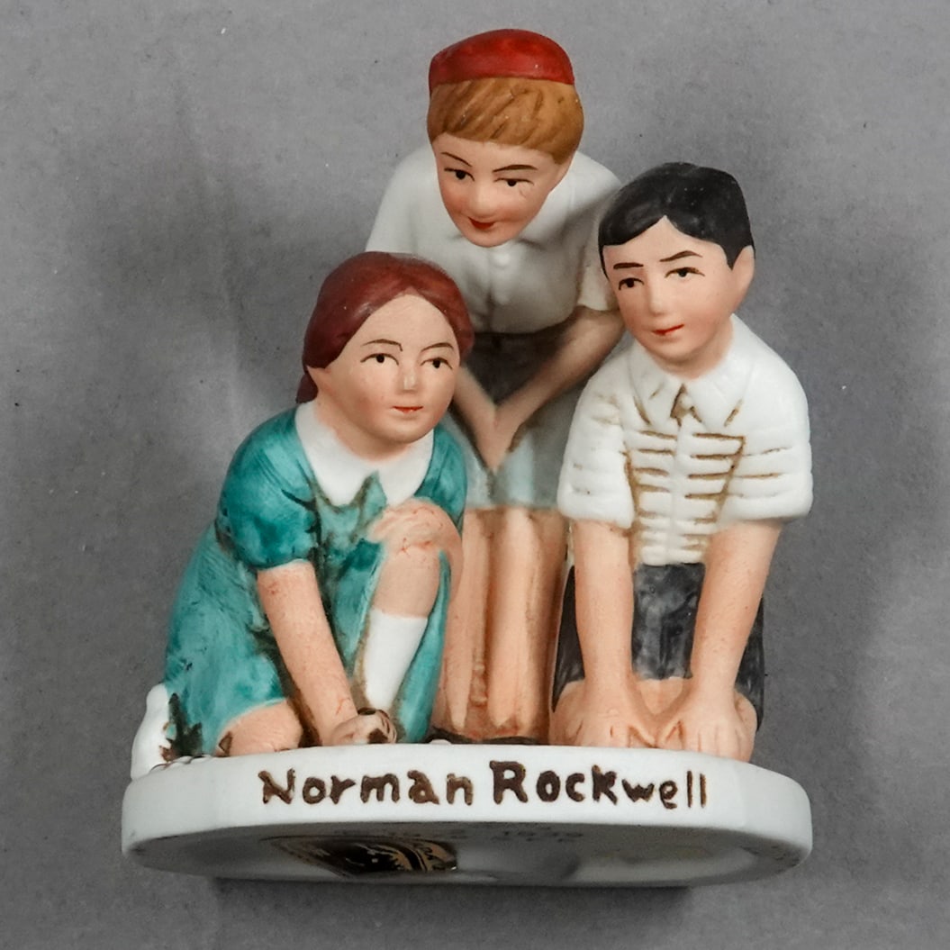 MISCELLANEOUS, Figurine. Porcelain Norman Rockwell.: MISCELLANEOUS, Figurine. Porcelain painted figurine of Norman Rockwell's Marble Shooter. Stamped on bottom. "NR-11 SEP 2 1939 c1979 S.E.P." and has a label as a Saturday Evening Post Authorized