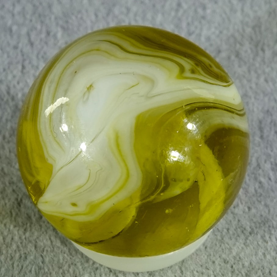 CHRISTENSEN AGATE COMPANY, Slag. 21/32". Mint (9.9).: CHRISTENSEN AGATE COMPANY, Slag. Handgathered Yellow Slag. Fluoresces orange. Cambridge OH, circa 1925-1930. 21/32". Mint (9.9).
