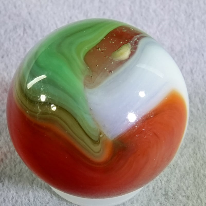 AKRO AGATE COMPANY, Corkscrew. 23/32". Mint (9.9).: AKRO AGATE COMPANY, Corkscrew. Sometimes called a Popeye Corkscrew but actually Spirals of red, light green and white on top of clear base. Clarksburg WV, circa 1925-1935. ex-collection: Ralph Stagg 2