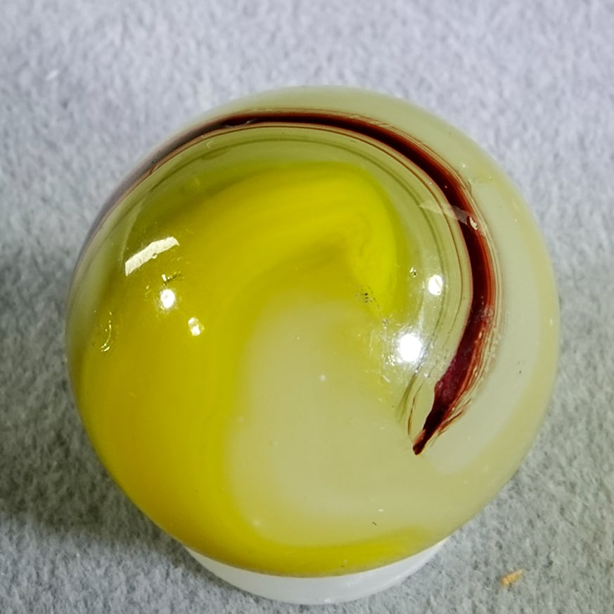 AKRO AGATE COMPANY, Egg Yolk Oxblood. 11/16". Mint (9.9). (1 of 7)