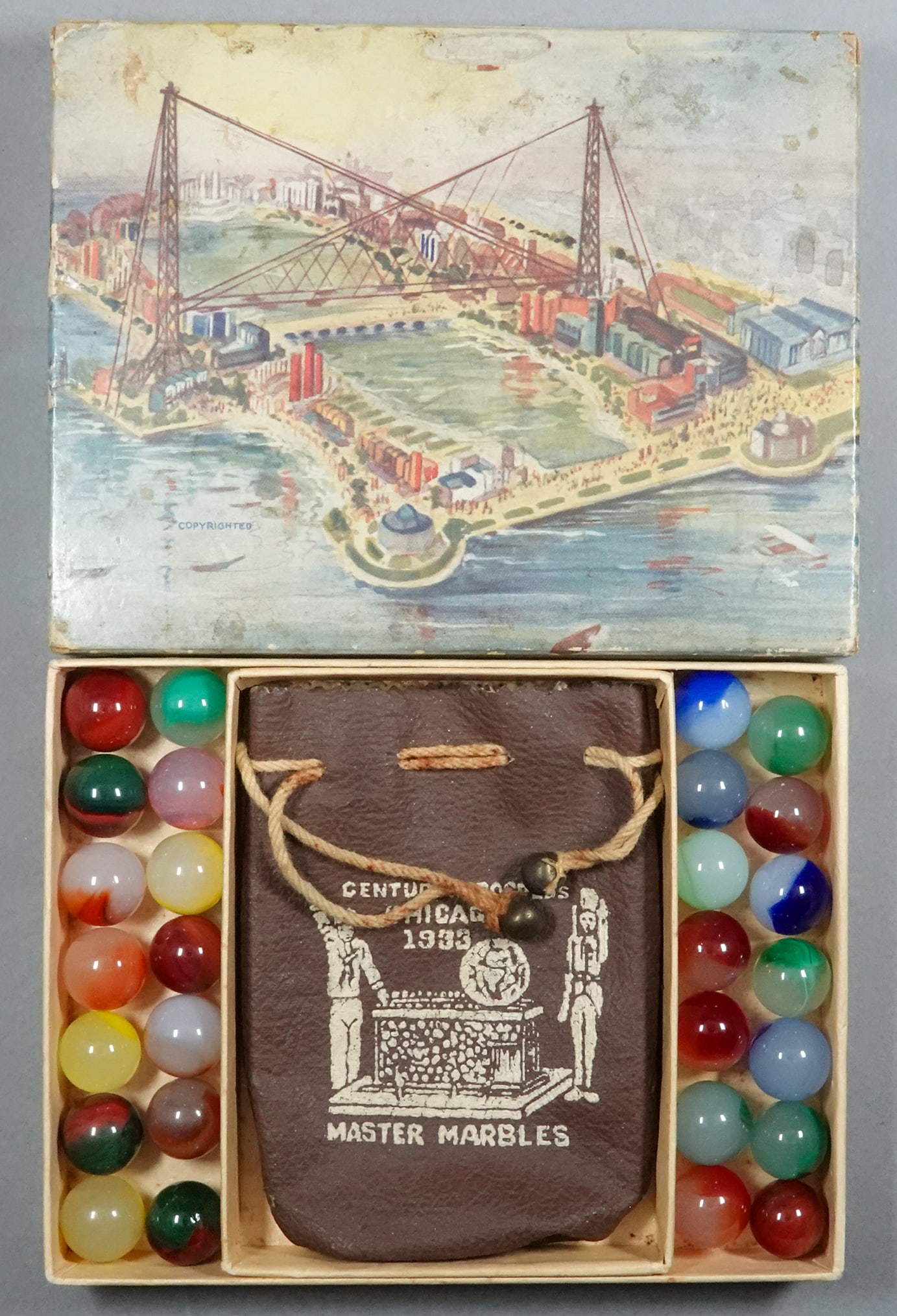 MASTER MARBLE COMPANY, Original Package. Century of Progress box.: MASTER MARBLE COMPANY, Original Package. An original World's Fair box. The box is the small size. Image of the World's Fair on the lid. Interior contains an original rubberized textile Century of