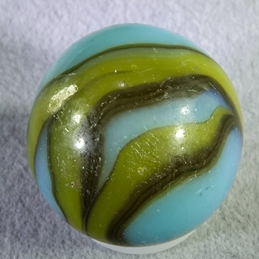 ALLEY AGATE COMPANY, Swirl. West Virginian. 23/32". Near Mint(+) (8.8).: ALLEY AGATE COMPANY, Swirl. West Virginian swirl. Shooter. Light pocket wear, possibly a dug marble. West Virginia, circa 1930-1940. 23/32". Near Mint(+) (8.8).