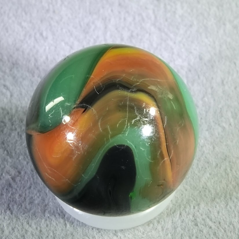 ALLEY AGATE COMPANY, Swirl. Carnival. 19/32". Buffed .: ALLEY AGATE COMPANY, Swirl. Carnival. Surface has been buffed, damage remains. West Virginia, circa 1930-1940. 19/32". Buffed .