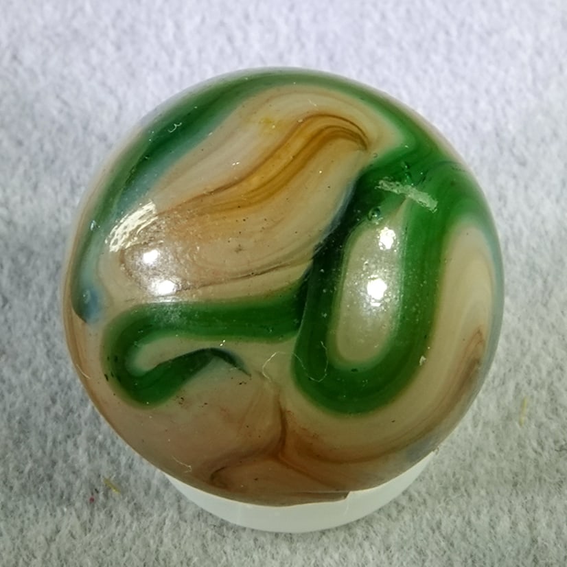 RAVENSWOOD NOVELTY WORKS, Swirl. Green Raven.21/32". Mint (9.5). (1 of 6)