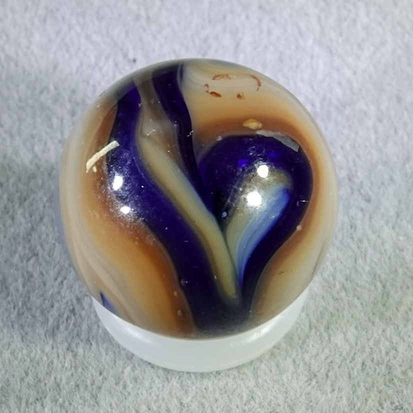 RAVENSWOOD NOVELTY WORKS, Swirl. Blue Raven. 19/32". Mint (9.9). (1 of 6)