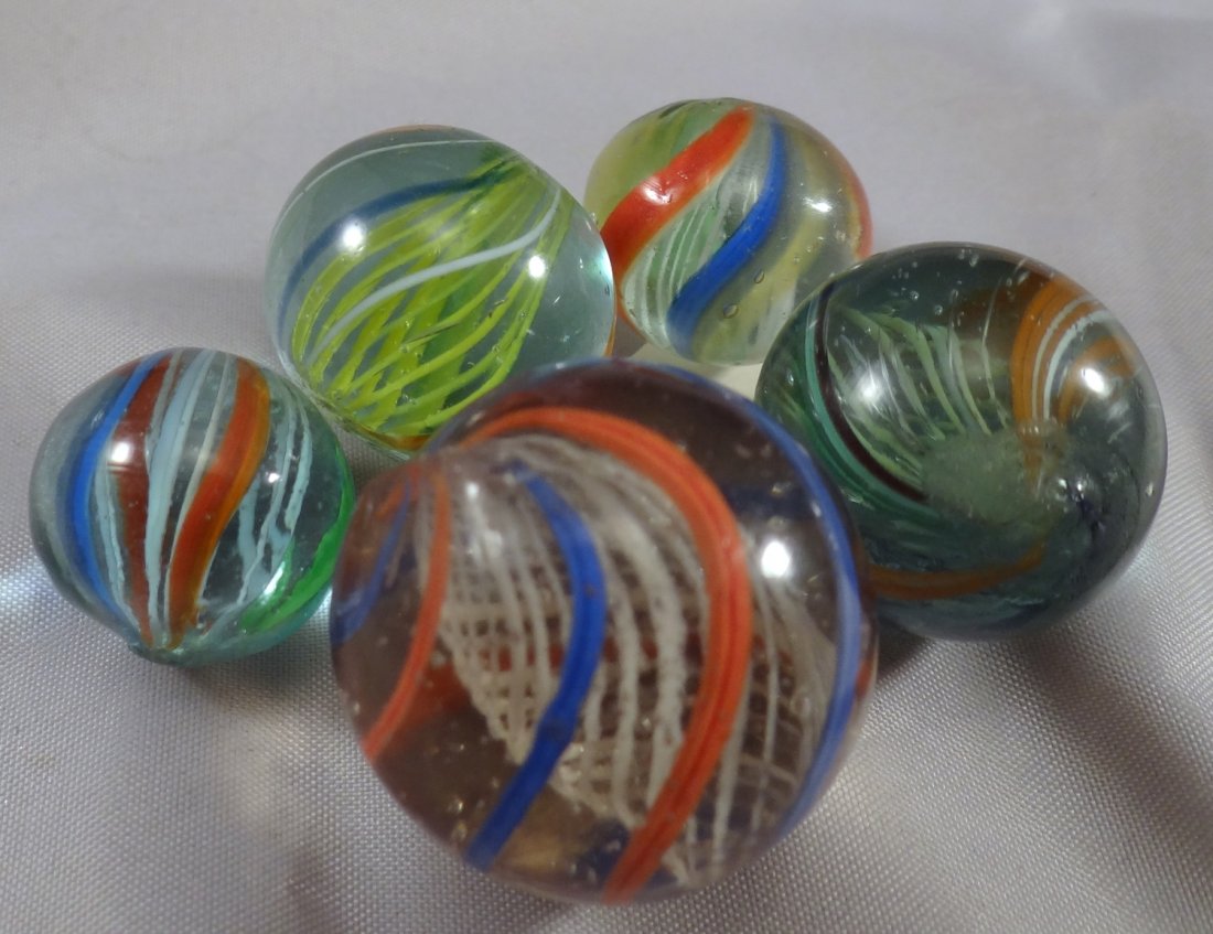 Marbles: Lot 2. SWIRL, 5 Latticinio Cores. Mint to: Lot 2. SWIRL, Latticinio Core. Lot of five marbles. All are Latticinio Core Swirls. Includes a rare banded alternating white and yellow core. All are Mint. Germany, circa 1860-1920. 21/32" to 1-1/8". 