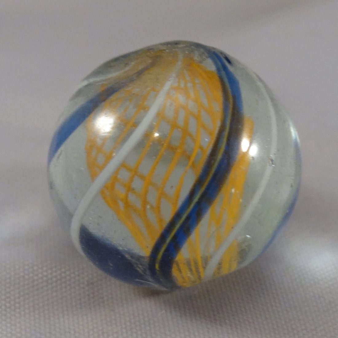 Marbles: Lot 48. SWIRL, Latticinio Core. Mint (9.9).: Lot 48. SWIRL, Latticinio Core. Orange Latticinio Core Swirl. Pale orange. Germany, circa 1860-1920. 11/16". Mint (9.9).