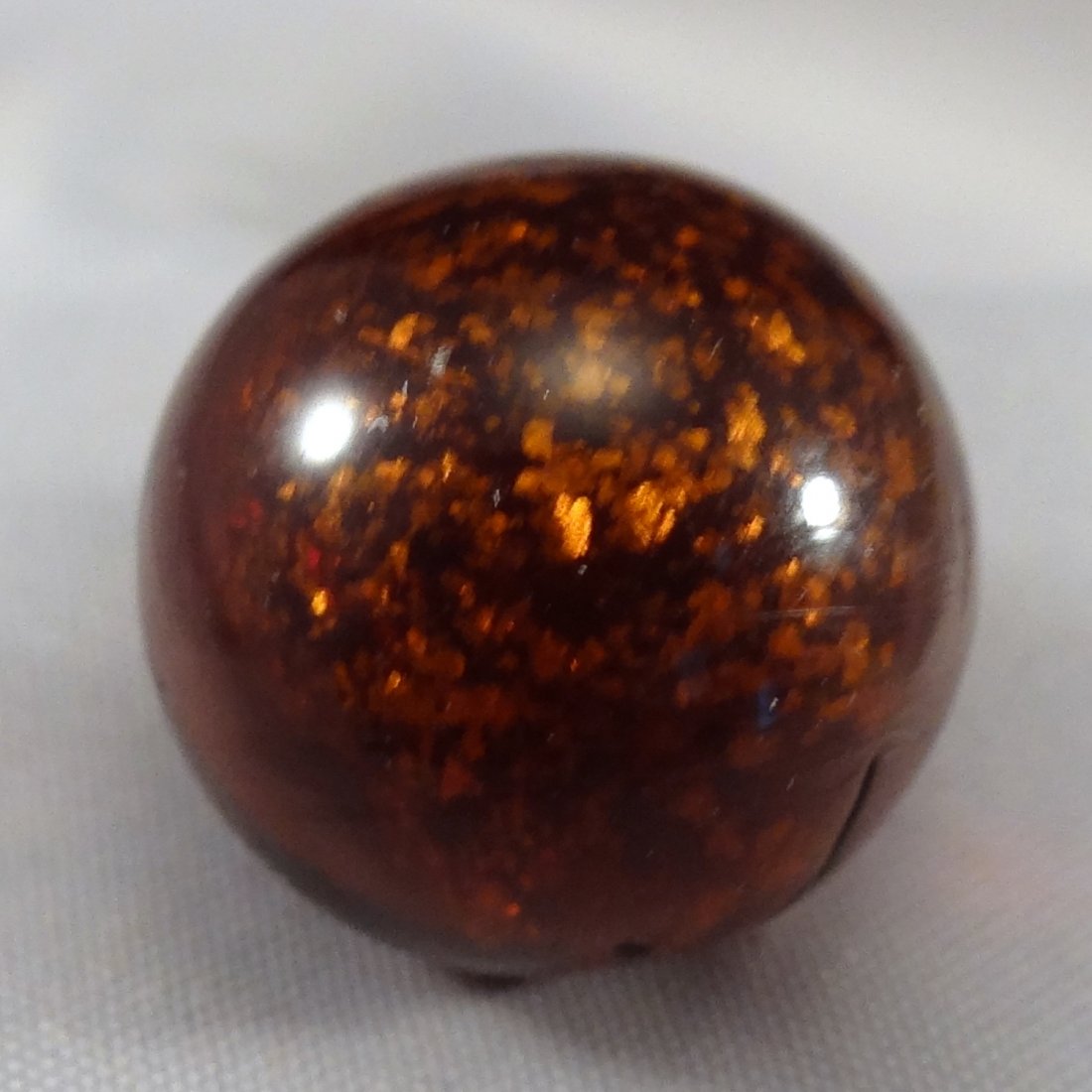 Marbles: Lot 124. HANDMADE, Mica. Mint (9.7). 5/8".: Lot 124. OTHER HANDMADE, Mica. Single pontil Cloud type. Nice dark brown, almost rust, Mica. Germany, circa 1860-1920. 5/8". Mint (9.7).