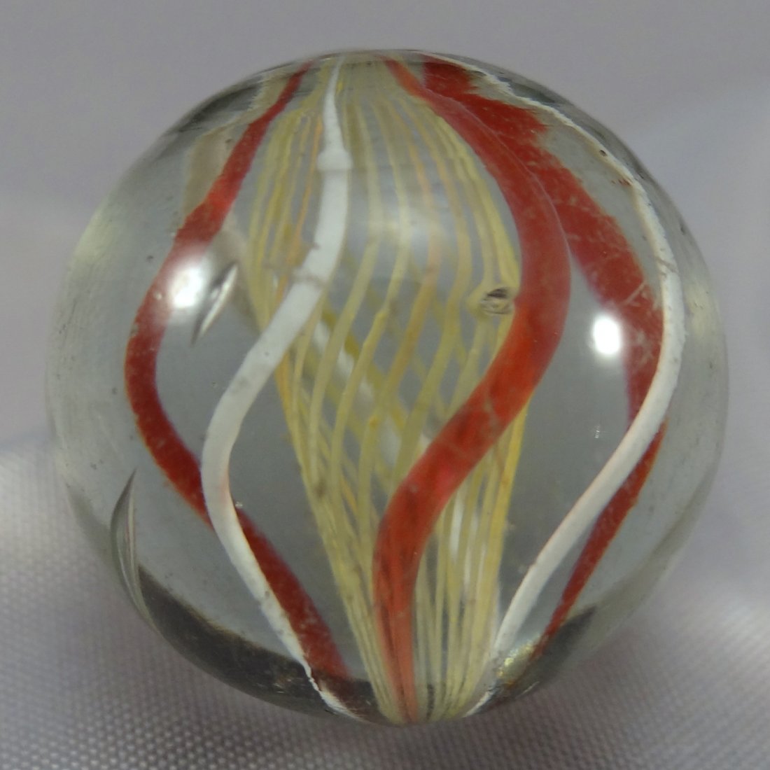 Marbles: Lot 177. SWIRL, Latticinio Core. Mint (9.5).: Lot 177. SWIRL, Latticinio Core. Pretty yellow Latticinio Core Swirl. Faceted pontil. Germany, circa 1860-1920. 7/8". Mint (9.5).