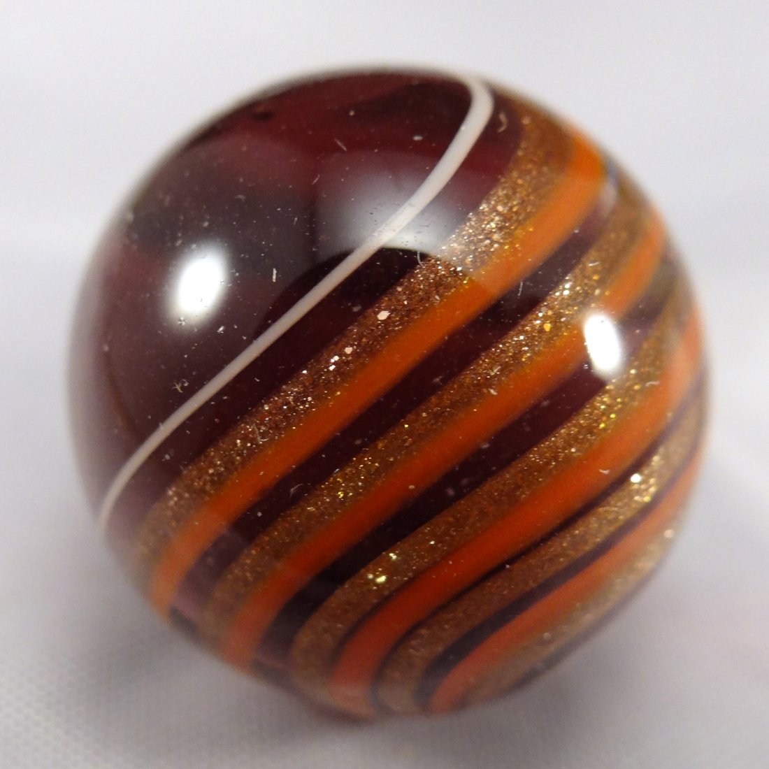 Marbles: Lot 196. CONTEMP, Dale Danowski. Mint (9.9).: Lot 196. CONTEMPORARY HANDMADE, Dale Danowski. Banded Lutz. Signed "DD". 25/32". Mint (9.9).