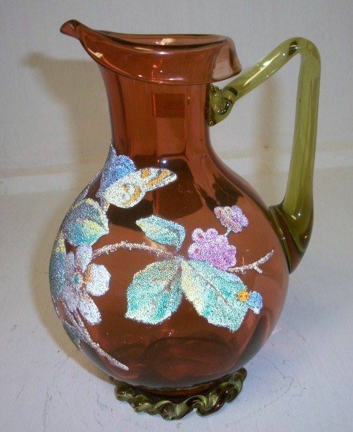 RARE Signed Thomas Webb Coralene Pitcher: 7 1/2" Signed Patent Coralene pitcher by Thomas Webb. Butterfly and floral coralene in dramatic colors and applied filigree glass near base. Very Rare item
