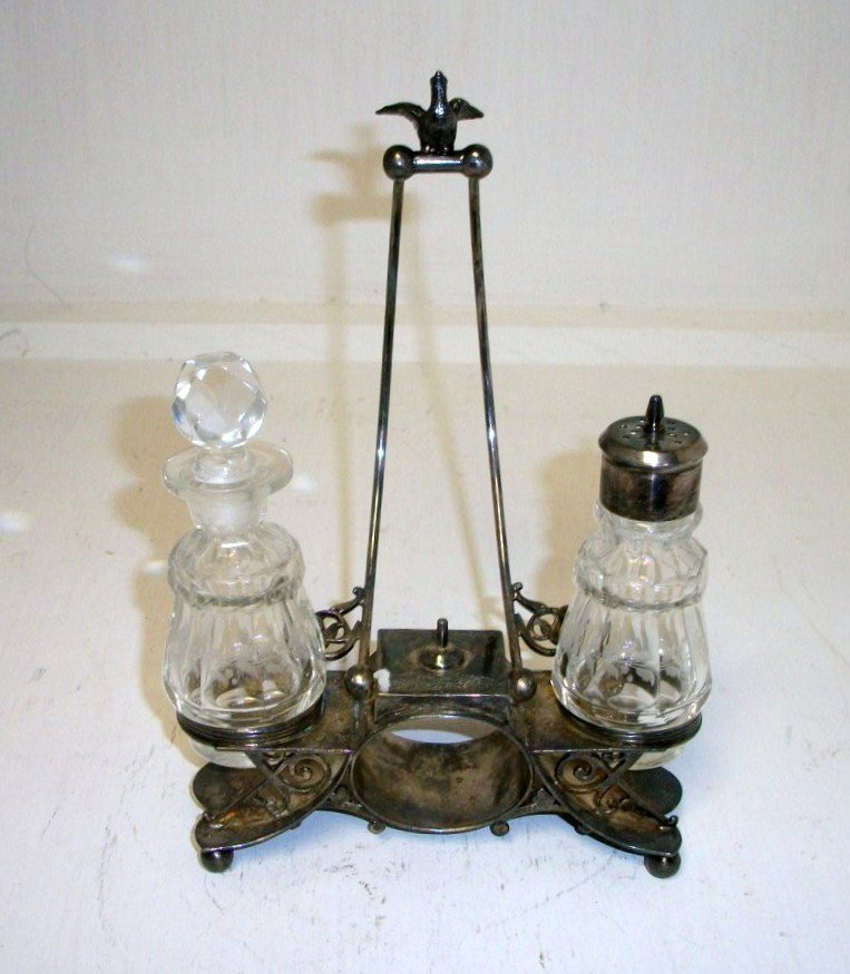 Condiment and napkin set: 8" tall dove finial condiment set signed Simpson Hall and Miller with napkin ring in middle of condiment holder unusual piece