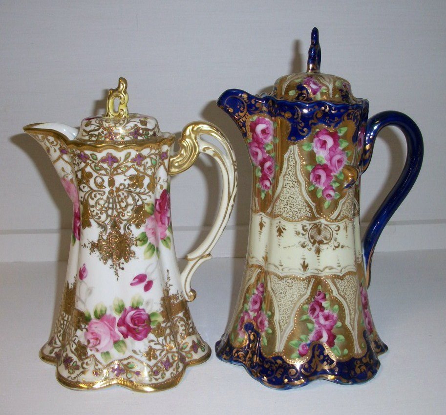 Nippon Chocolate Pots: lot of 2 Nippon chocolate pots. 9" gold and floral blue mapleleaf mark, 10 1/2" tall Cobalt and gold unsigned