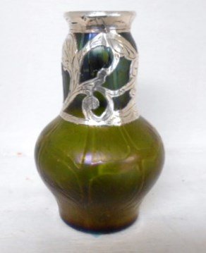 Silver Overlay Loetz Vase: 5 1/2" tall Silver overlay Loetz of Austria vase. Silver floral rim and collar signed 999. Green iridescent glass with stunning color. Highly polished unsigned pontil.