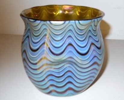 Loetz of Austria Vase: 4 1/4" iridescent pinched sides vase with a highly polished pontil signed Loetz Austria.