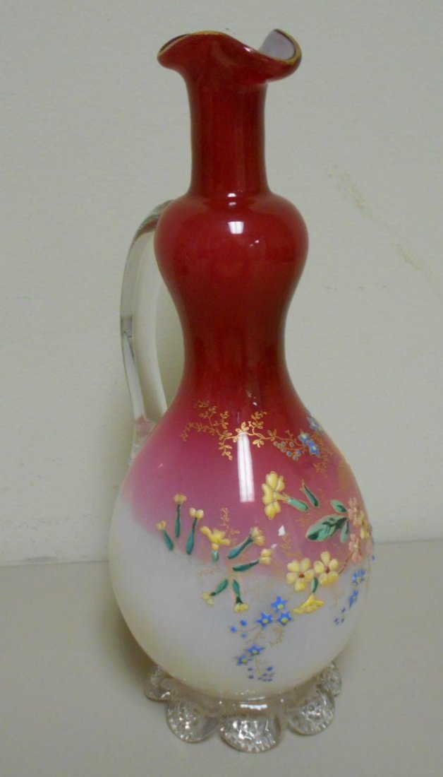 English Enameled Opalescent Ewer: 10 3/4\" tall opalescent white to Cranberry ewer. Heavily enameled floral motif with applied glass base and Unsigned polished pontil. Attributed to Stevens and Williams or Webb.